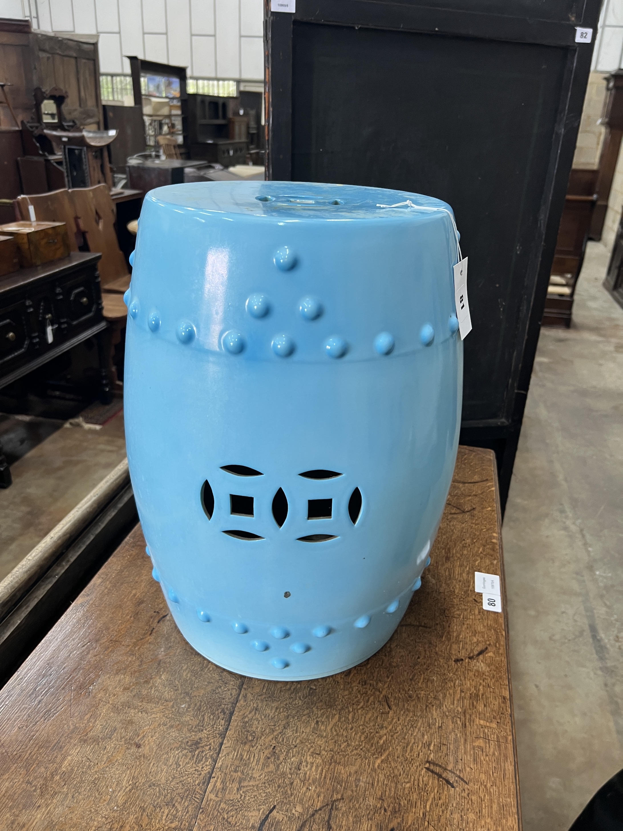 A Chinese style blue glazed ceramic seat, height 49cm